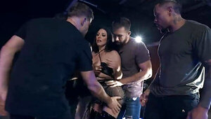Sexy busty brunette begins taking multiple dicks at once
