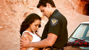 A sexy babe with a nice pussy is fucked by a cop in the desert