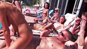 Hot girls are having group sex by the pool and are partying