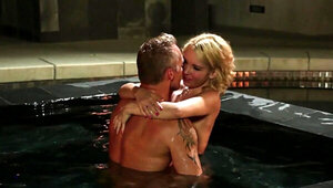 A blonde with small tits is kissed and fucked in the pool
