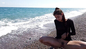 Seaside masturbation session from a leggy brunette babe