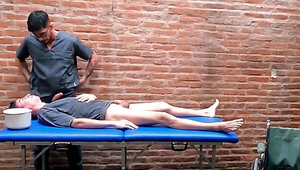The male nurse gives him a massage and a handjob too