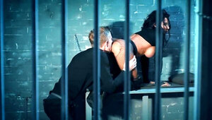 Hot brunette prisoner is being fucked by a jailkeeper