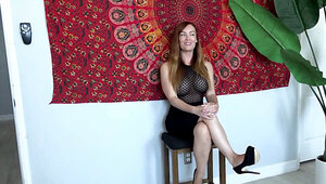 Busty redhead Dani Jensen wearing a seethrough shirt