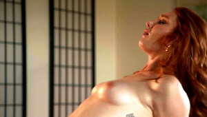 Redhead bombshell rides a horny man in romantic sex video