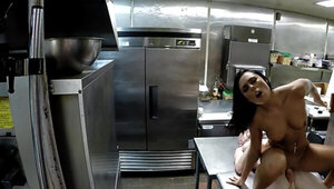 A hot babe is getting her wet pussy fucked well in the kitchen