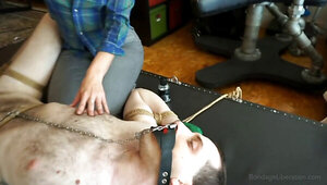 Submissive man and a dominatrix that loves using him