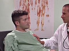 Erotic gay threesome in a doctors office