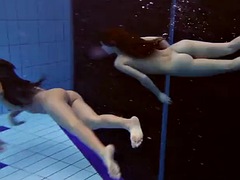 Three naked hotties in the pool