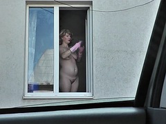 Neighbor taxi driver watches MILF neighbor washing apartment window naked. Naked in public