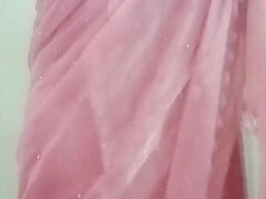Indian Gay Crossdresser Gaurisissy Pressing and Playing with Her Big Boobs Looking in Pink Saree Looking Like a Housewife