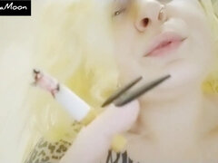 Close up - Blonde with Long Nails Smokes a Cigar