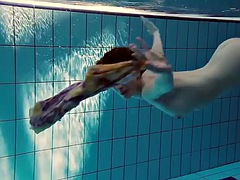Hot teen Lera with big boobs swims in the pool