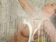 Abigail Mac rubs her perfect tits in the shower cabin & cums hard