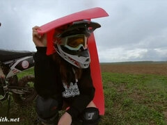 Naked woman riding a Dirt Bike