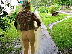 Girl in raincoat showing tits and ass in the city streets