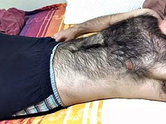 A very hairy man gives a soft dick massage and touches his hairy chest with a big bulge