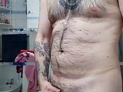 Hairy bear shows his huge cock and masturbates