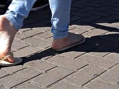 Candid teenage flip flop feet and soles on street