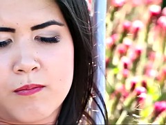 naughty lady dee pees and masturbates in a flower field