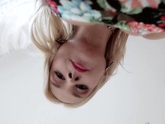 A blonde is removing her dress & jumping on top of a big fella