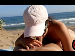 Sucking cock on a public nude beach, 100% real.