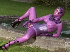 Latex-Clad Lucy: Odd Escapade in the Garden