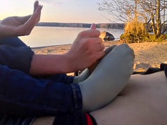 Oxy gave a footjob in a public place by the pond