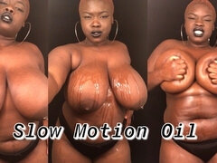 Slow Motion of BBW Rubbing Oil on Natural Black Tits & Curvy Body