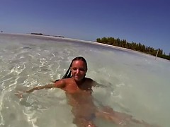 topless russian swimming in tropical sea