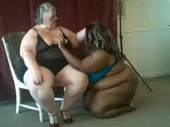 Chocolate and Cream ssbbw models posing laughing
