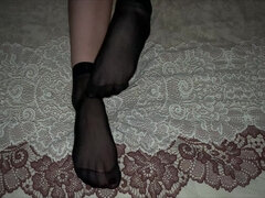 Girl in Black Nylon Socks Caresses Her Legs
