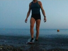 Alexa Cosmic Swimming in the Sea After Sunset in Clothes. Wetlook in Sneakers, Shorts and T-shirt