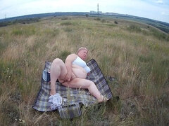 Fat Woman Masturbates With a Toy in the Field