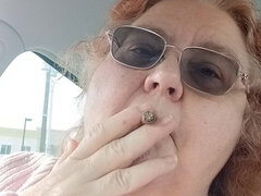 BBW smoking in pink sweater in her car talking to her fans