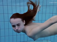 super slender girl showing off her beauty underwater