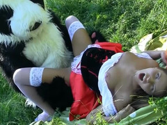 Fella in a panda suit is penetrating a busty woman in the field