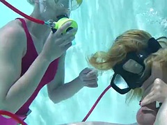 Two hot girls suck a big cock in the pool