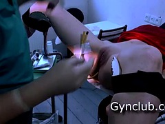 Full gynecological examination of a girl on a gynecological chair
