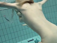 girls swimming underwater and enjoying eachother