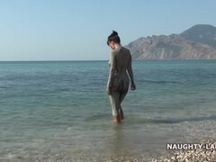 Naughty & Dirty MILF exhibitionist in mud pool on the public beach