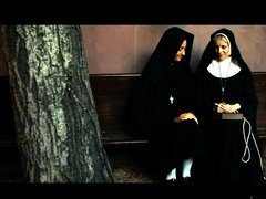Sexy nuns are playing with each other in front of the camera