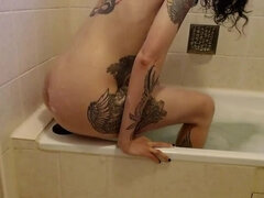 German slut takes a bath in her own piss, fucks huge dildos and gets a hard fistfuck