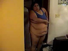 Large fat Alma Smego is filmed getting dressed by her closet