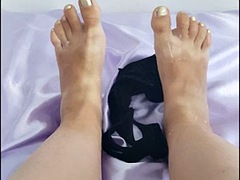 Foot fetish with black lace thongs covered in cosmetics