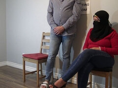 Muslim Woman Cheating in Waiting Room