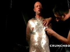 BDSM session with bondage and spanking in backroom