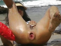 Sparkling fun at the beach with large red dragon sextoy anal