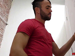 Bearded dude blowing off a ebony cock at a gloryhole