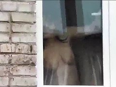 Bare mom washes window son spies on mommy. nude in public. stagging hidden cam